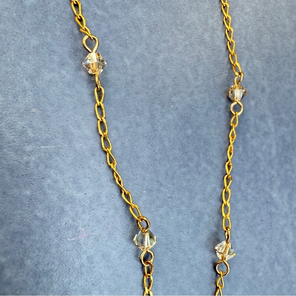 Belladonna Circular Crystal and Gold Tone Infinity Pendant Necklace - Picture 13 of 17